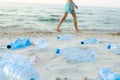 Plastic bottles on sea beach. Environmental pollution by plastic waste