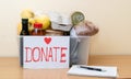 Plastic box with a set of products and a red donut text heart sign.