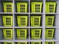 Numbered plastic boxes in their cells are arranged in order in wooden rack
