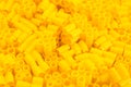 Plastic bricks of yellow color and details of the toy. Yellow background. Place for text or advertising Royalty Free Stock Photo