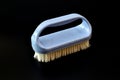 Plastic brush for clothes on a black background. Royalty Free Stock Photo