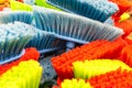 Plastic brushes. Multicolored, polymer broom. Close-up Royalty Free Stock Photo