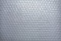 Plastic Bubble Cushioning Wrap surface texture on white background, Close up shot, Transparent wrapping concept