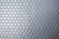 Plastic Bubble Cushioning Wrap surface texture on white background, Close up shot, Transparent wrapping concept
