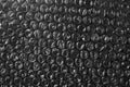 Plastic bubble wrap texture background on black Royalty Free Stock Photo