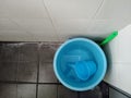 A Plastic bucket in the corner bathroom Royalty Free Stock Photo