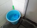 A Plastic bucket in the corner bathroom Royalty Free Stock Photo