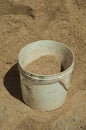 Plastic bucket with sand in a construction site