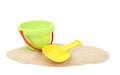 Plastic bucket and showel on sand isolated Royalty Free Stock Photo
