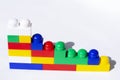 Plastic building blocks on a light blue background. Children`s educational toys. Children`s construction kit Royalty Free Stock Photo