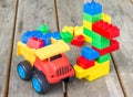 Plastic building blocks and toy truck Royalty Free Stock Photo