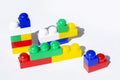 Plastic building blocks on a white background. Children`s educational toys. Children`s construction kit Royalty Free Stock Photo