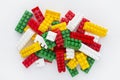 Plastic building toy blocks on white background. Pile of colorful childrens building bricks on white background Royalty Free Stock Photo