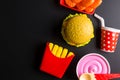 Plastic burger, French fries Fast food on black background. Children's toy. Concept of harmful artificial food. Plastic. Not Royalty Free Stock Photo