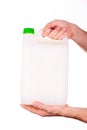 Plastic canister in hand on white background Royalty Free Stock Photo