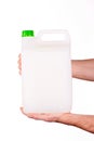 Plastic canister in hand on white background Royalty Free Stock Photo