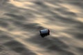Plastic cans garbage floating on the sewage water