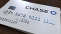 Plastic card with logo of the Chase Bank. Editorial conceptual 3D rendering