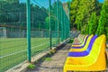 Plastic chairs near stadium. Old empty seat near sport field Royalty Free Stock Photo