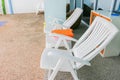 Plastic chairs in a swimming pool invite you to relax Royalty Free Stock Photo