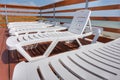 Plastic chaise lounges stand near the pool Royalty Free Stock Photo