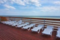 Plastic chaise lounges stand near the pool Royalty Free Stock Photo