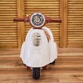 Plastic children motorcycle riding in the playroom, toy brown moped fo