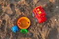 Plastic children toys on the sand Royalty Free Stock Photo