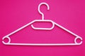 Plastic Clothes Hanger, plastic clothes-hanger on pink background. Shopping and sale concept background.