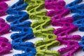 Plastic clothes pegs, assorted colors, bright and colorful, placed all over the area. For various uses