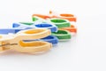 Plastic clothes pegs isolated on white background. Royalty Free Stock Photo