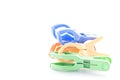 Plastic clothes pegs isolated on white background. Royalty Free Stock Photo