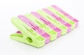 Plastic clothes pegs over white Royalty Free Stock Photo