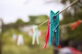 Plastic clothespin hanging on a rope Royalty Free Stock Photo