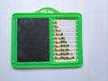 Plastic Colorful Beeds for Abacus , Black Board Slate with Chalk Piece isolated on white background