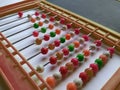 Plastic Colorful Beeds for Abacus , Black Board Slate with Chalk Piece isolated on white background