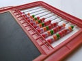 Plastic Colorful Beeds for Abacus , Black Board Slate with Chalk Piece isolated on white background