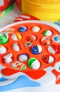 Plastic colorful fishing game with fishes with the blurred background