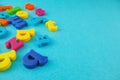 Plastic colourful alphabet letters on the blue background