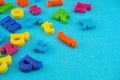 Plastic colourful alphabet letters on the blue background