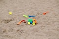 Plastic colourful children toys lying on ground on playground Royalty Free Stock Photo