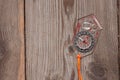 Plastic compass over a wooden background Royalty Free Stock Photo