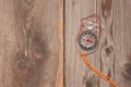 Plastic compass over a wooden background Royalty Free Stock Photo