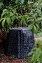 Plastic compost box in garden. Concept of waste separation, reusing of waste, fertilizer. Royalty Free Stock Photo