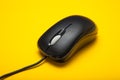 Plastic computer mouse close-up on a yellow background Royalty Free Stock Photo