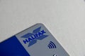 Plastic contactless Halifax bank card on patterned background.
