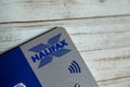 Plastic contactless Halifax bank card on patterned background.