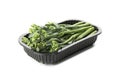 Plastic container with broccolini isolated on white background Royalty Free Stock Photo