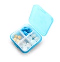 Plastic container with different pills on white background Royalty Free Stock Photo