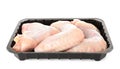 Plastic container with raw chicken wings on white. Fresh meat Royalty Free Stock Photo